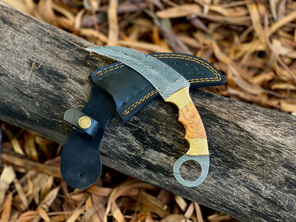 Damascus karambit utility knife with olive wood handle and leather sheath