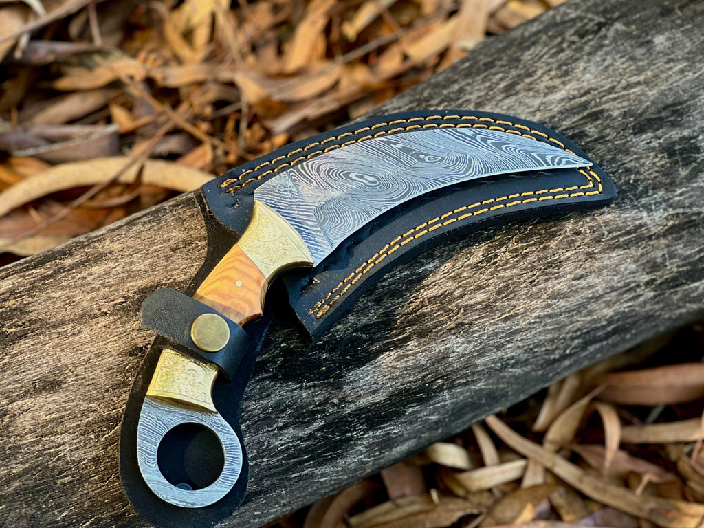Damascus karambit utility knife with olive wood handle and leather sheath