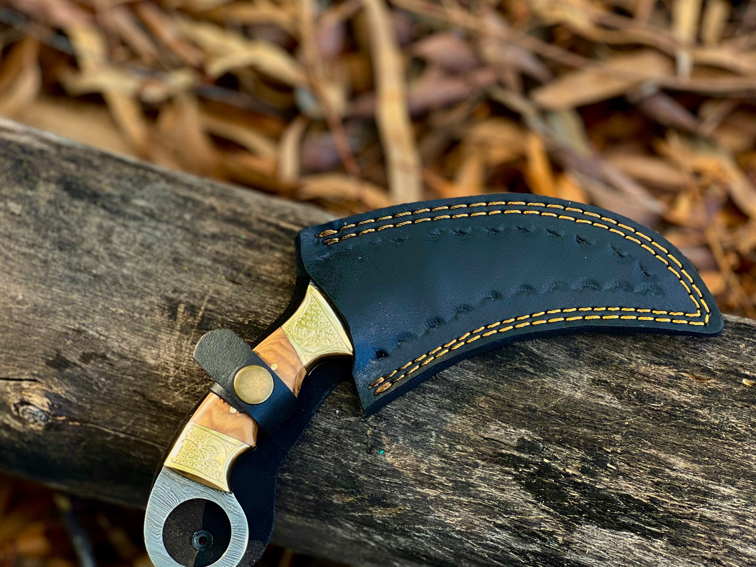 Damascus karambit utility knife with olive wood handle and leather sheath