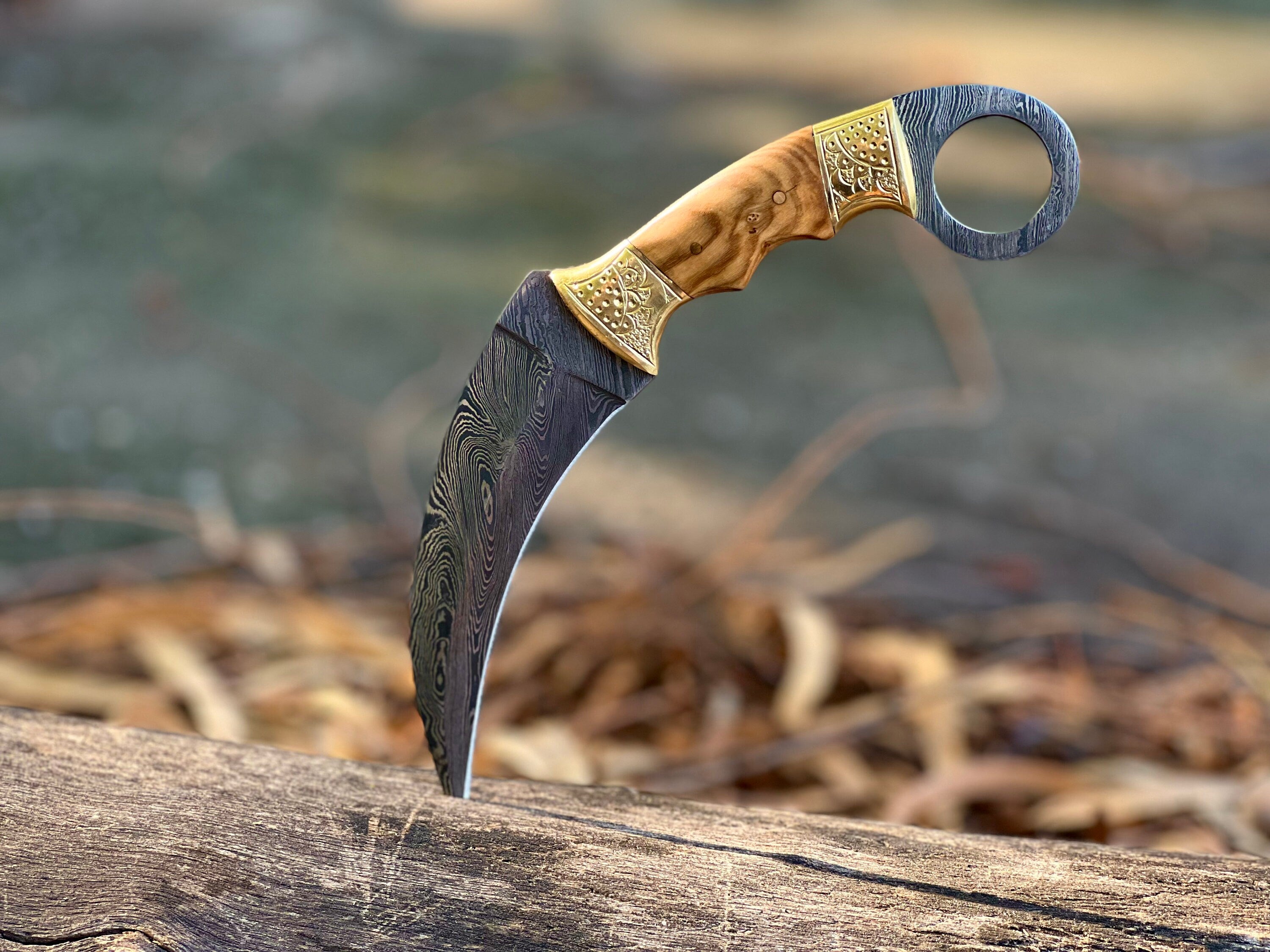 Damascus karambit utility knife with olive wood handle and leather sheath