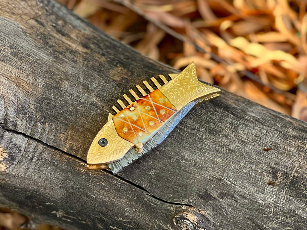 Kingfisher Damascus folding knife with engraved fish-shaped brass bolster