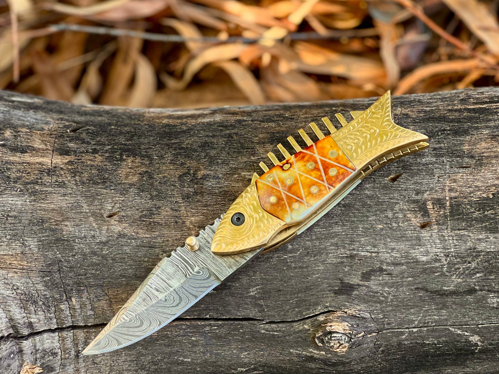 Kingfisher Damascus folding knife with engraved fish-shaped brass bolster