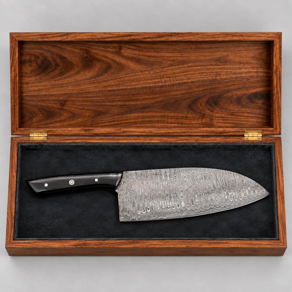 Top view of the open wooden gift box with a Damascus cleaver on charcoal velvet